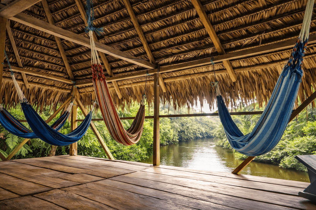 Hammocks for lounging by the river in Tucan Cuyabeno Amazon Lodge in Ecuador.