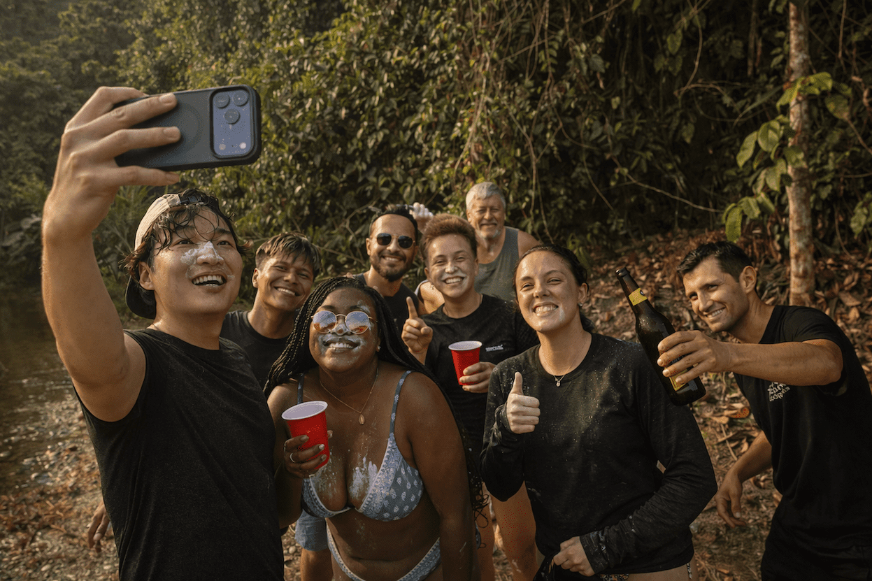 A group of friends having homemade beer in Ecuador cuyabeno tucan lodge